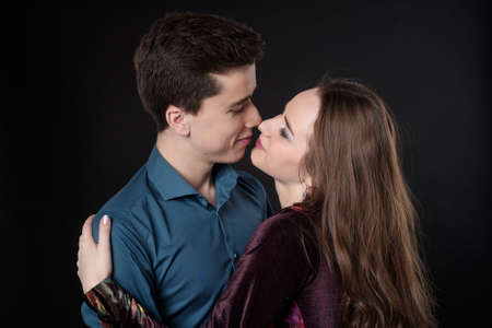 Valentine Couple. Portrait of Smiling Beauty Girl and her Handsome Boyfriend. Happy Joyful Family....