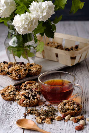 Cup of tea and cookies made of nuts and raisins. Kozinaki.の写真素材