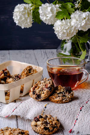 Cup of tea and cookies made of nuts and raisins. Kozinaki.の写真素材