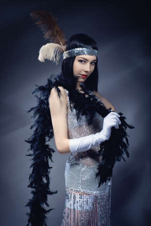 Elegant woman in the white dress with black necklet. Retro style. Old fashion.