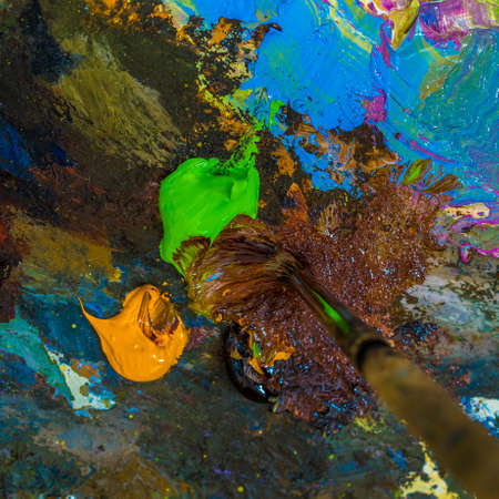 Paintbrush on the palette for mixing oil paints.の写真素材