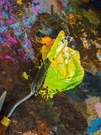 Palette knife on a palette for mixing oil paints.の写真素材
