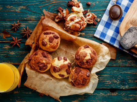Homemade Tasty Chocolate muffins on the wooden table, rustic style.の写真素材