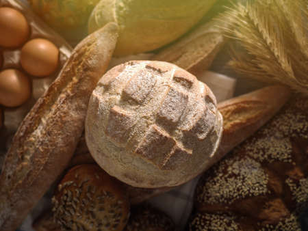 Different kinds of bread on background