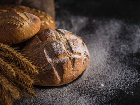 Different kinds of bread on backgroundの写真素材
