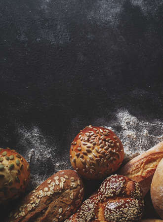 Assortment of fresh bread on the table. Copyspace for text.