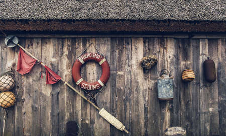 Various fishing tackle on a wooden backgroundの写真素材