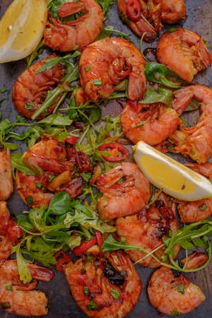 Large grilled BBQ shrimp with sweet chili sauce, green onion and lemonの写真素材