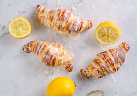 Fresh homemade croissants with lemon icingの写真素材