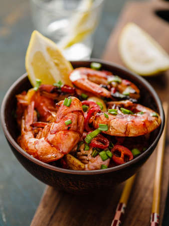 Large grilled BBQ shrimp with sweet chili sauce, green onion and lemonの写真素材