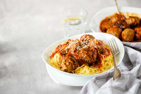 Delicious homemade meat balls in tomato sauce with spaghetti. Copyspace.の写真素材
