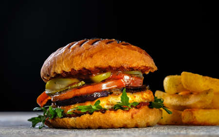 Fresh juicy delicious homemade burger. Hamburger with meat and fresh herbs.の写真素材