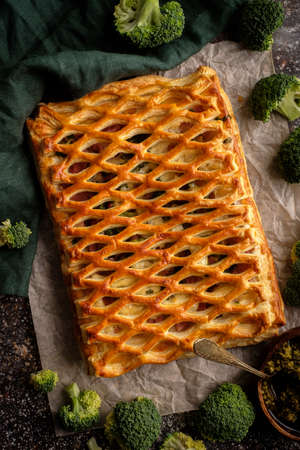 Chicken pie with broccoli from puff pastry top view.の写真素材