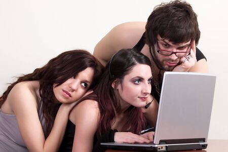 Group of young students preparing for exam on laptopの写真素材