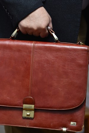 Businessman in formal suite with briefcaseの写真素材