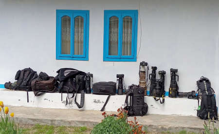 Many photocameras on the ground.When photographers rest, their cameras are waiting for their hosts