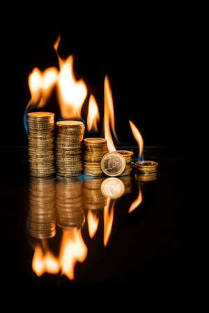 Euro coin with fire flames.の写真素材