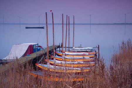 recreation sailing boats on lake at sunset
