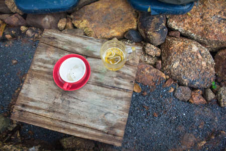 Coffee cups old red wooden tablesの写真素材