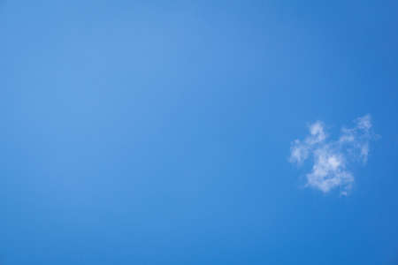 blue sky background a cloud one small cubesの写真素材