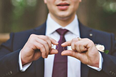 picture of man with gift box and wedding ring.の写真素材