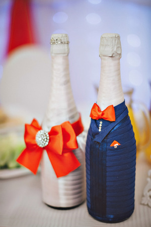 decorative champagne bottle violet color on the holiday table.の写真素材