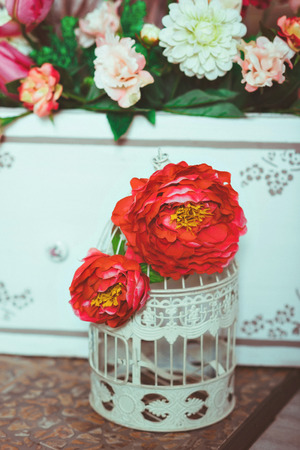 Beautiful decorative cage with beautiful flowers.の写真素材