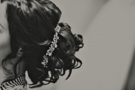 Wedding hairstyle on long hair with a precious decoration. Decoration for hair.の写真素材