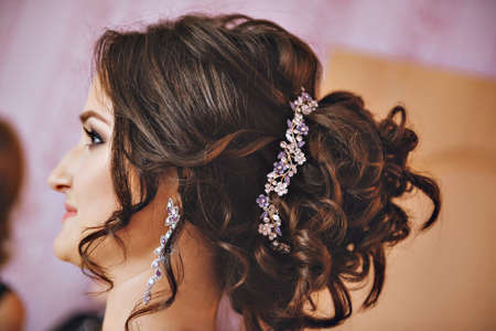 Wedding hairstyle on long hair with a precious decoration. Decoration for hair.の写真素材