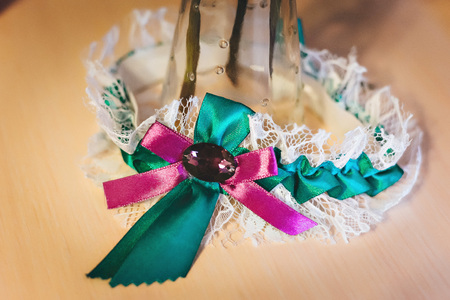 Earrings with green gemstone. Beautiful jewelry. Aged goldの写真素材