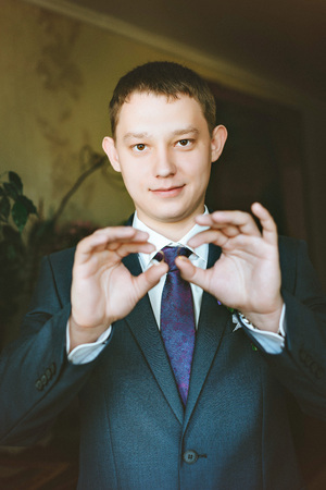 Wedding rings in the hands of men.