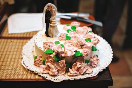 Wedding cake, decorative figurines of the bride and groom.の写真素材