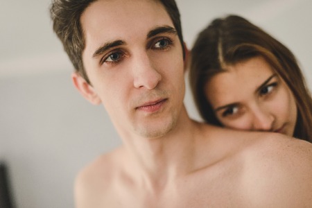Loving couple in the kitchen. The problem between the young woman and manの写真素材