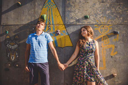 Couple men and women near the climbing wallの写真素材