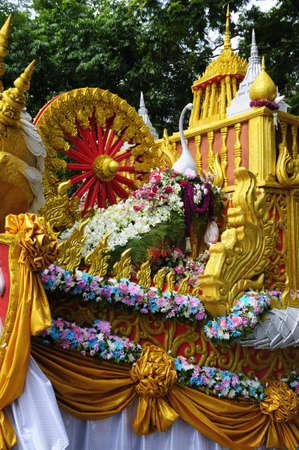 The parade car in Thai traditional offering flowers to Buddhist monks ceremony の写真素材