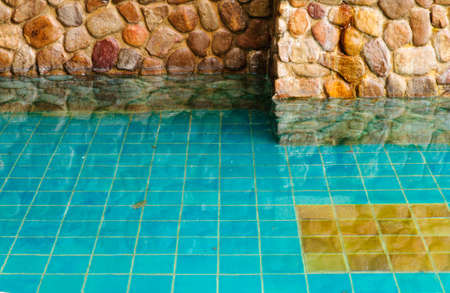 Brick wall and reflection in waterの写真素材