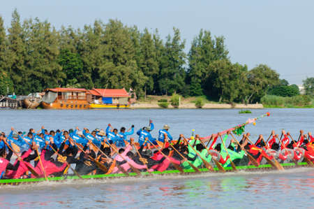Pathumthani, Thailand - NOV 03, 2013  Two rowing teams in full speed during Thai Long-tailed Boat Competition along river at Samkhok, Pathumthani, Thailand のeditorial素材