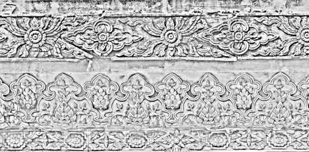 Black and white of Traditional Thai style art on the temple wall, Thailand 