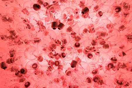 Idea concept with red light bulbs backgroundの写真素材