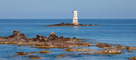 the lighthouse of the boat eater of calasetta, south sardinia, on a beautiful summer dayの写真素材