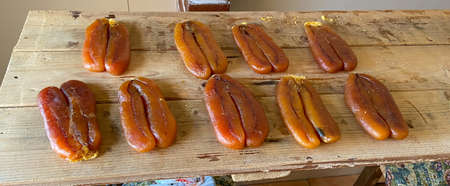 Bottarga, cured fish roe of gray mullet on wood backgroundの写真素材