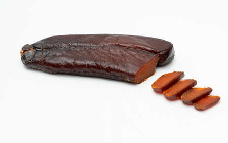 Bottarga, cured fish roe of gray mullet on white backgroundの写真素材