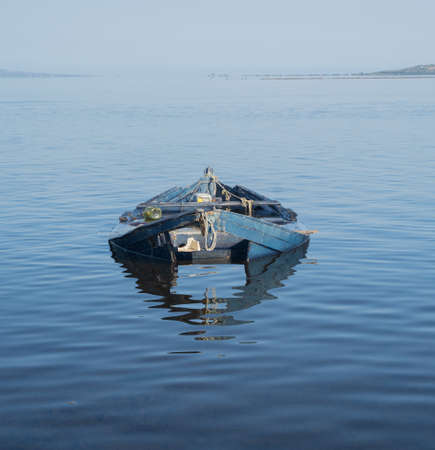 Boat in the water. Fishing boat in the calm waters of the pond of santa caterina in southern sardiniaの写真素材
