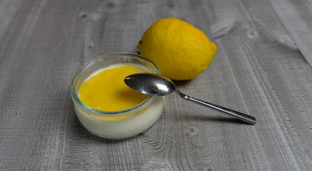 Delicious lemon curd, fresh fruit on a gray backgroundの写真素材