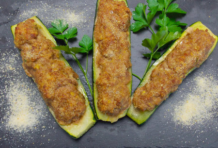 Baked zucchini stuffed with beef and cheese, typical Italian dishの写真素材
