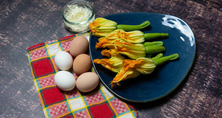 fresh zucchini flowers ready to be fried, typical italian foodの写真素材