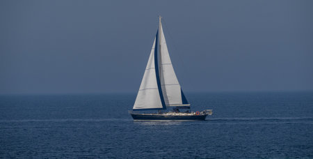 A sailboat anchored in Calasetta, south Sardinia, Italy