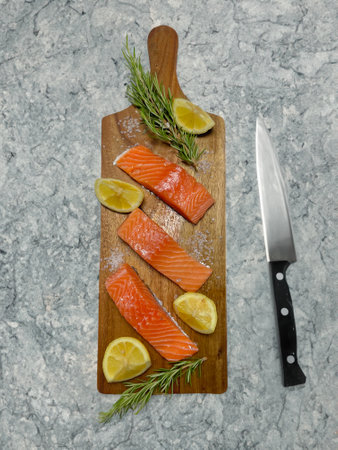 Salmon fillet with rosemary and lemonの写真素材