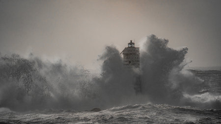 Lighthouse storm - lighthouse eaters during a winter swell in Calasetta in southern Sardinia