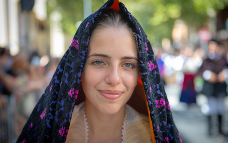 NUORO, ITALY - 2017 JULY 16 - traditional Sardinian dress worn by beautiful girlsのeditorial素材